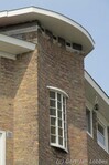 Gevel Maasstraat met geaccentueerde portiek en trappenhuis.
<br/>
Gert-Jan Lobbes, 2016